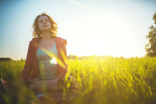istock Yoga Meditation Outdoors in Lotus Position 1004694126