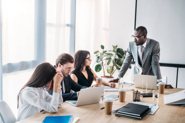 istock multicultural business people having business meeting in office 1004694784