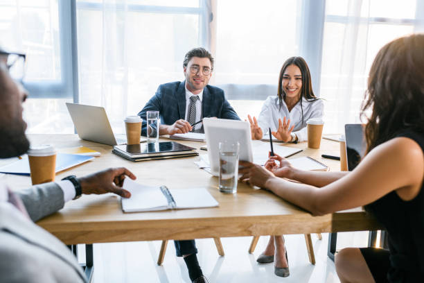 istock selective focus of group of multiethnic business colleagues discussing strategy during business meeting in office 1004694844