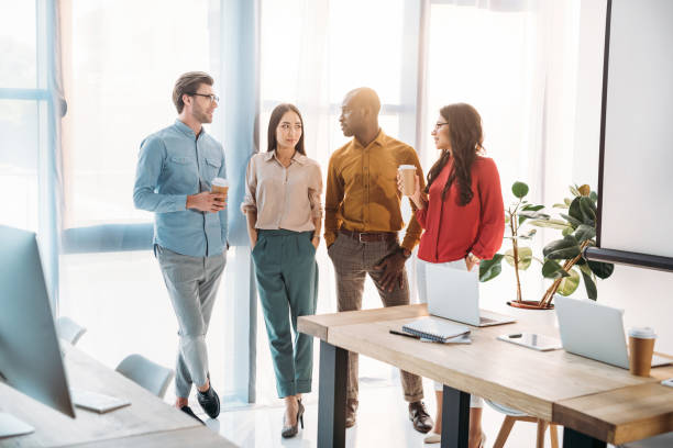 istock group of multicultural business people having conversation during coffee break in office 1004695188