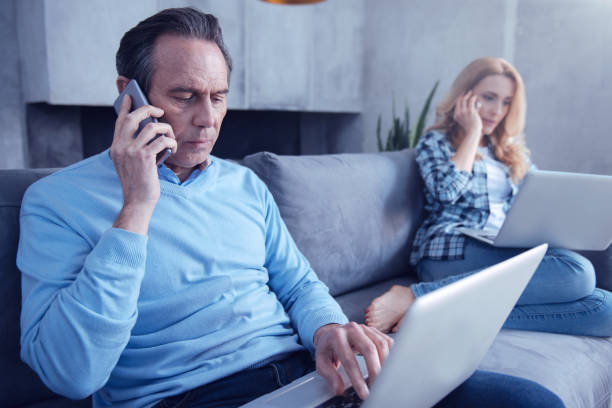 istock Nice pleasant man talking on the phone 1004703730