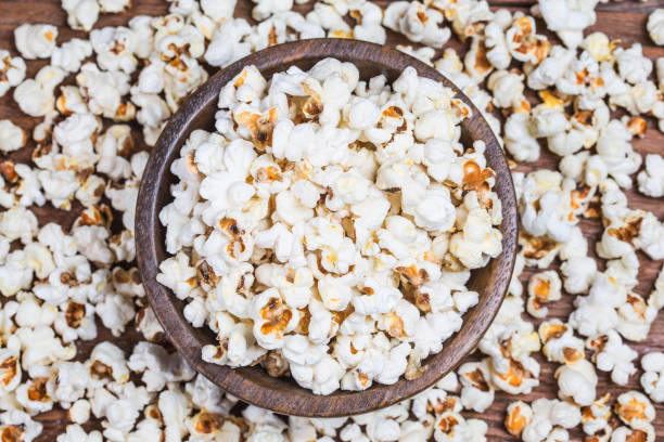 istock Salt popcorn on the wooden table, 1004709146