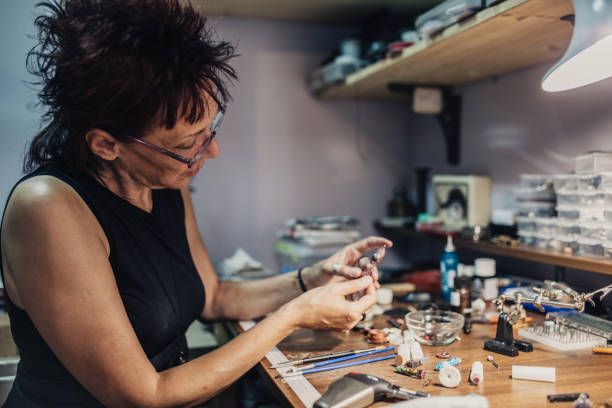istock Woman making jewelry in a store 1004721808