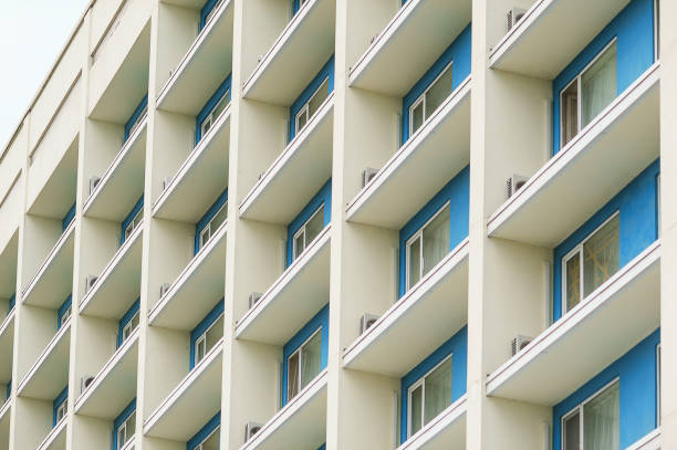 part of a modern multi-storey office building with balconies and windows.