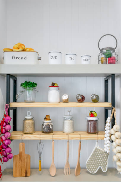 istock Kitchen shelves with various food ingredients and utensils. 1004728032