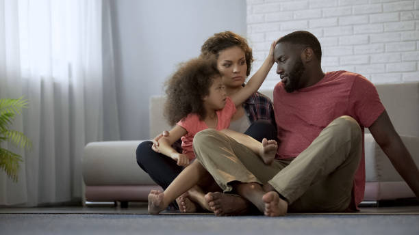 istock Caring daughter touching fathers forehead, checking temperature of sick dad 1004734850