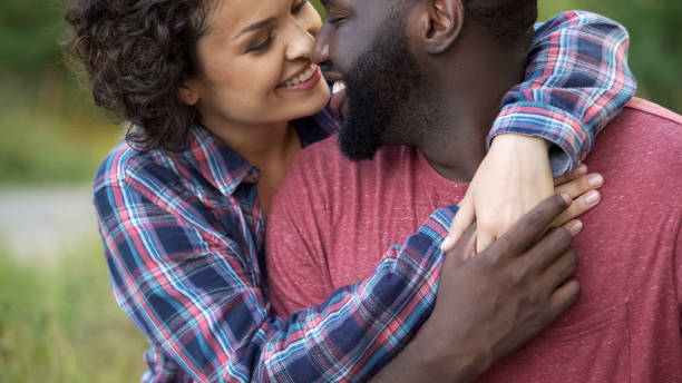 istock Two people in love show affection for each other, delicately touching noses 1004734966