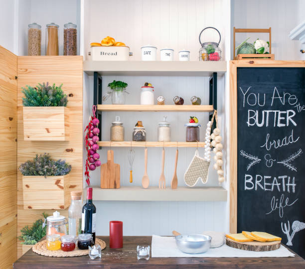 istock Kitchen shelves with various food ingredients and utensils. 1004738156