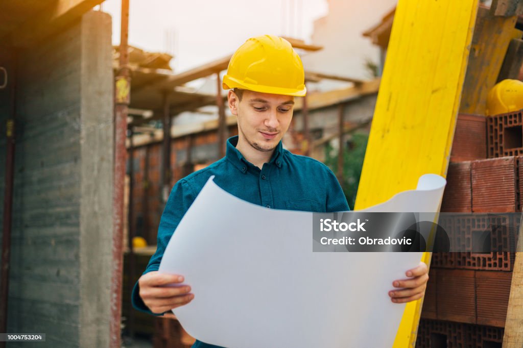 Condtruction Engineer Construction Engineer Checking The Blueprints Stock Photo - Download ...