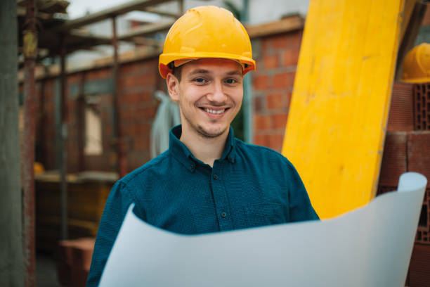istock Portrait of construction engineer on building site 1004753320