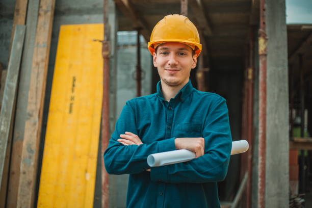 Portrait of construction engineer on building site stock photo