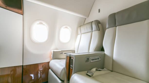 istock Interior of empty ready to fly airliner cabin with rows of seats. 1004753714
