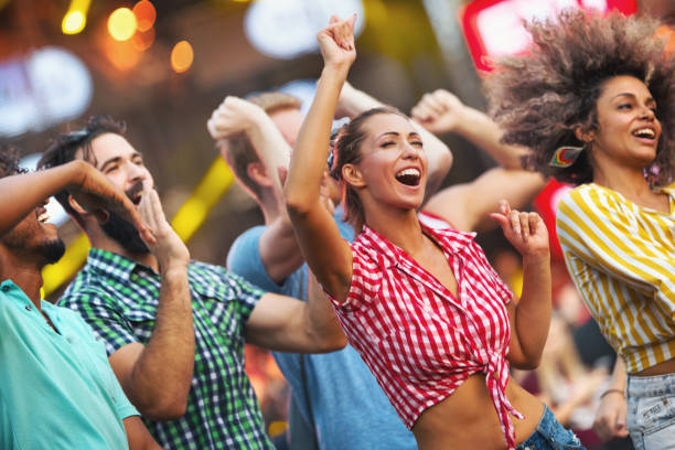 istock Friends dancing at a concert. 1004768868