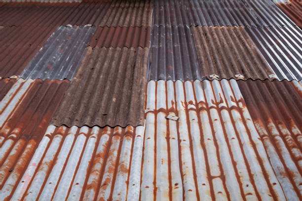 istock Pattern of Rusty zinc roof on old house texture and background. 1004772730