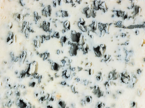 Blue cheese texture or background. Close up. Danish blue cheese texture or background. Close up. Top view roquefort cheese stock pictures, royalty-free photos & images