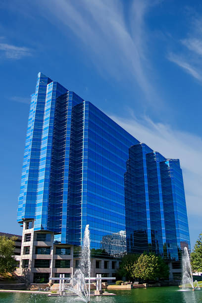 istock Blue Glass  Building on Lake 1004778928