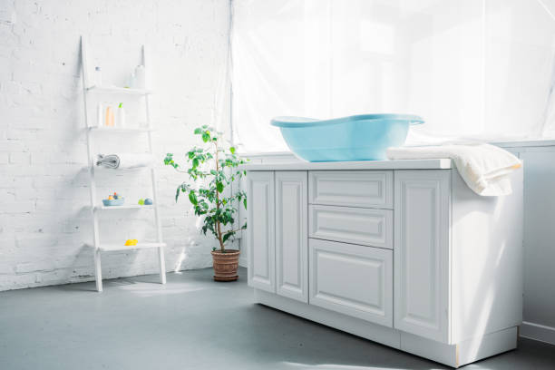 istock blue plastic childrens bathtub on stand in white modern room 1004785812
