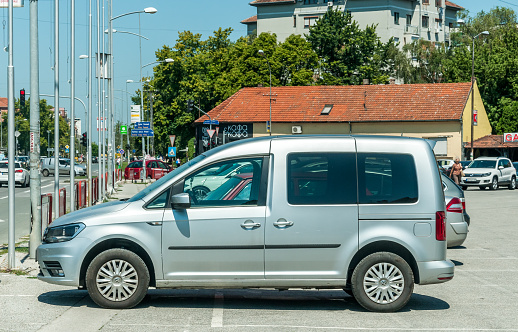Novi Sad, Serbia. July -20 . 2018. Silver VW Volkswagen Caddy Maxi 2.0 TDI car parked on the street.