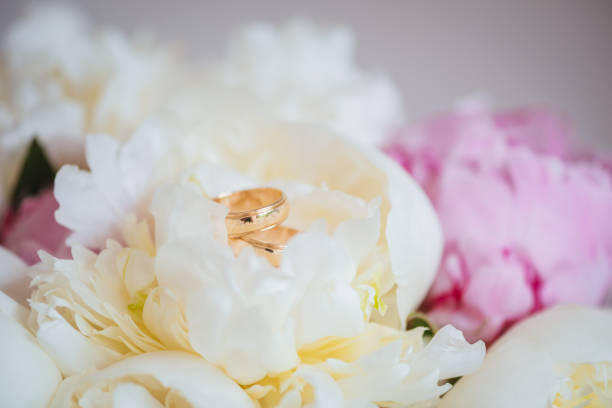 istock Wedding rings in a wedding bouquet 1004798074