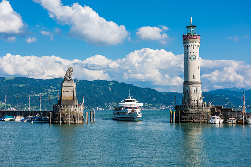 Germany, Lindau - August 21: view of the lighthouse and a lion statue at the entrance to the port of Lindau at lake Constance, Bodensee on August 21, 2015