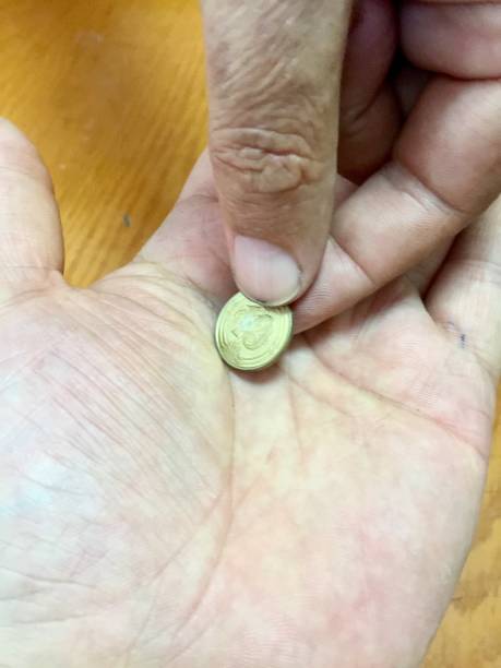 istock gave a handful of coins 1004801200