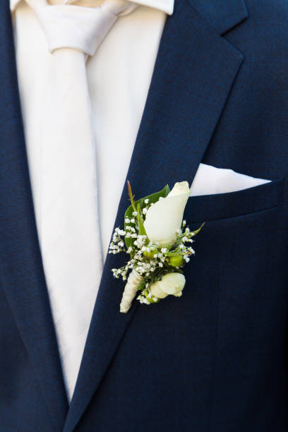 istock Groom with rose boutonniere on wedding 1004801332