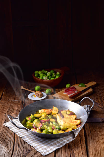 istock Brussels Sprouts with ham ,honey and roasted potatoes 1004801628