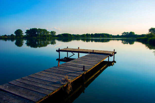 istock Wooden jetty on the lake 1004804270