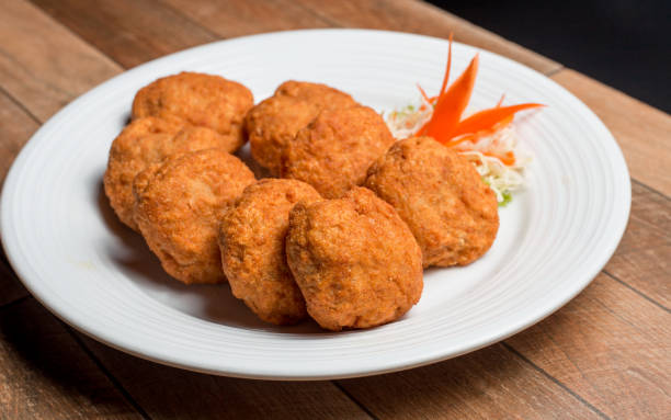 istock Thai Food Fried Shrimp Cake (Tod Mun Kung) on white plate 1004806616