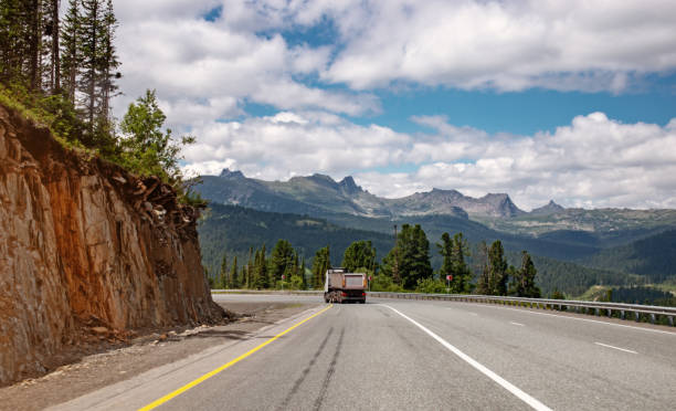 istock Truck climbs the mountains 1004817706