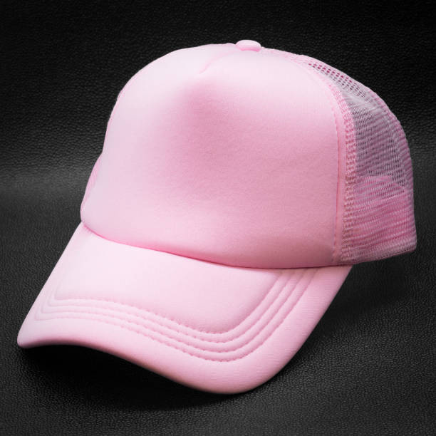 istock Pink cap on dark background. Fashion hat for design. 1004823944