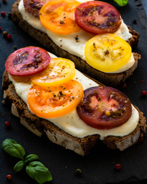 istock rye bread with cream cheese and color tomatoes 1004824102