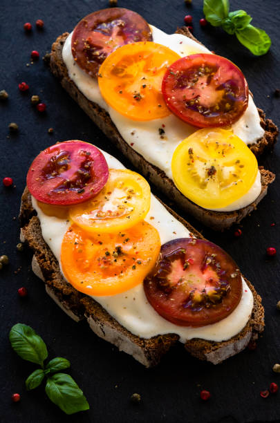 istock rye bread with cream cheese and color tomatoes 1004824126