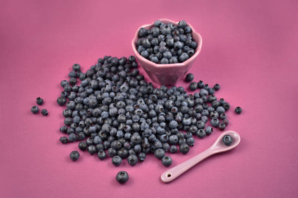 istock Blueberries with bowl and spoon stock images 1004824168