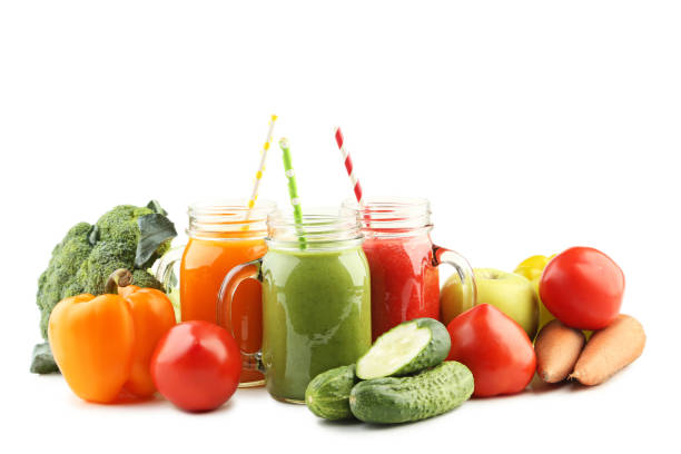 istock Vegetables smoothie in jars isolated on white 1004836406