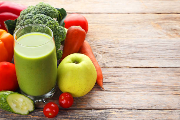 istock Vegetables smoothie in glasses on grey wooden table 1004839598