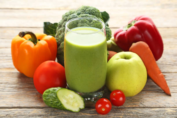 istock Vegetables smoothie in glasses on grey wooden table 1004841810