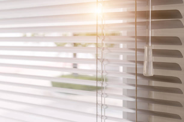 istock Blinds of sunlight come through the house. 1004842184