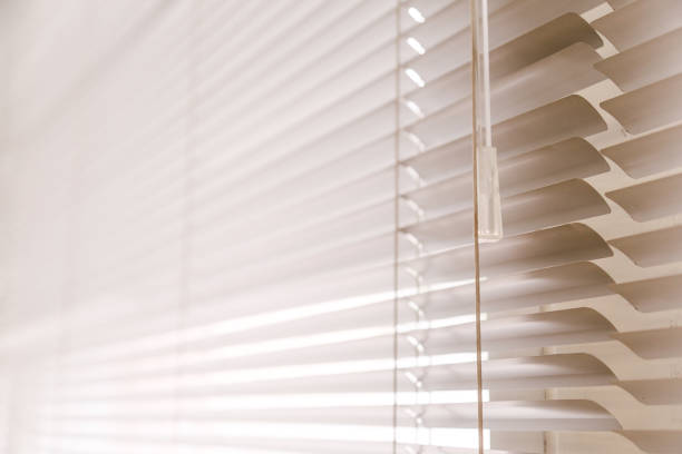 istock Blinds of sunlight come through the house. 1004842200
