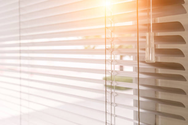 istock Blinds of sunlight come through the house. 1004842208