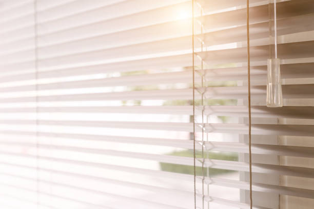 istock Blinds of sunlight come through the house. 1004842214