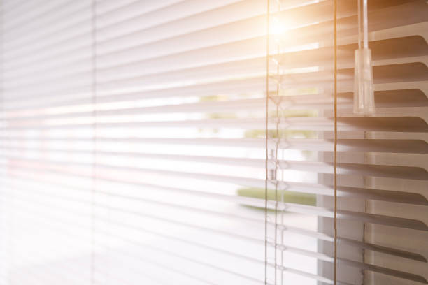 istock Blinds of sunlight come through the house. 1004842254