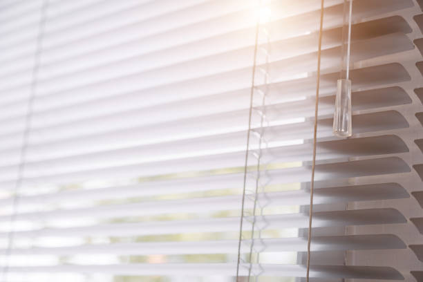istock Blinds of sunlight come through the house. 1004842258