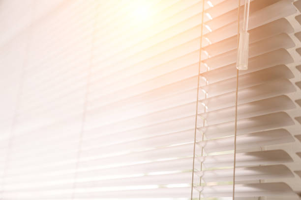 istock Blinds of sunlight come through the house. 1004842338