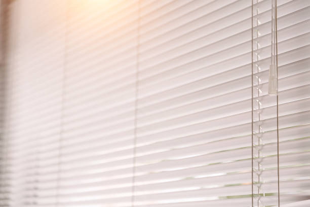 istock Blinds of sunlight come through the house. 1004842354