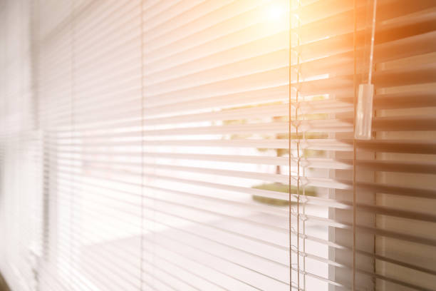 istock Blinds of sunlight come through the house. 1004842402
