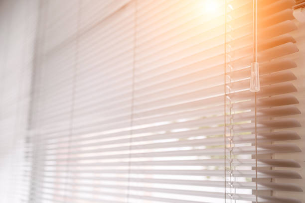 istock Blinds of sunlight come through the house. 1004842442