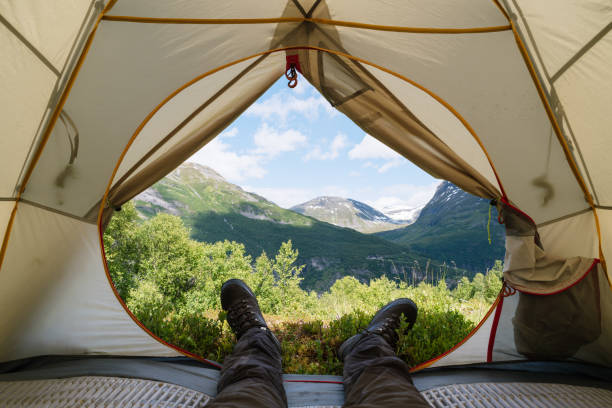 istock Guy in tourist boots in the mountains 1004842450