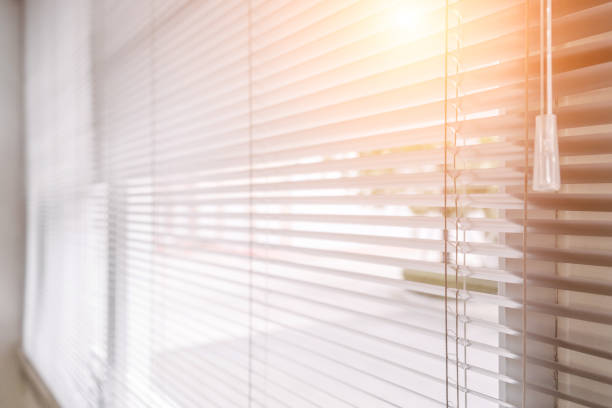 istock Blinds of sunlight come through the house. 1004842466