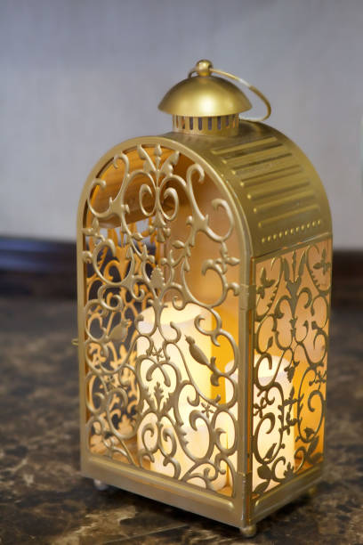 istock Candlestick flashlight made of metal with white candles. 1004845620